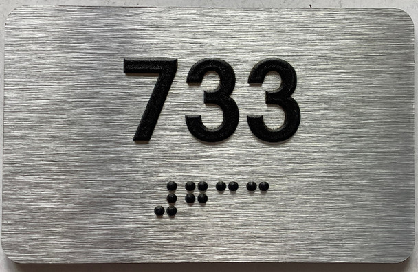 apartment number 733 sign