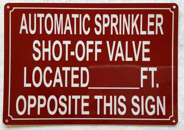 AUTOMATIC SPRINKLER SHUT OFF VALVE LOCATED FEET OPPOSITE THIS SIGN SIGN