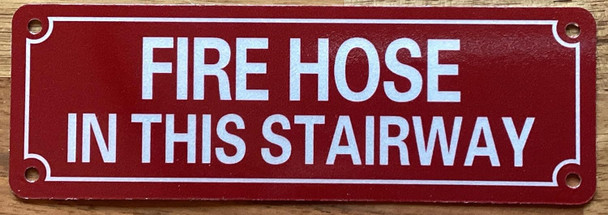 FIRE HOSE IN THIS STAIRWAY SIGN