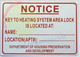 KEY TO HEATING SYSTEM AREA LOCK IS LOCATED AT