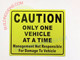 SIGN CAUTION ONLY ONE VEHICLE AT A TIME