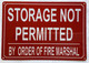 STORAGE NOT PERMITTED BY THE ORDER OF FIRE MARSHAL COMPLIANCE SIGN