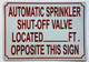 AUTOMATIC SPRINKLER SHUT OFF VALVE LOCATED FEET OPPOSITE THIS SAFETY SIGN SAFETY SIGN