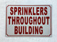 FD SPRINKLERS THROUGHOUT BUILDING SIGN