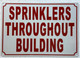 SPRINKLERS THROUGHOUT BUILDING SAFETY SIGN