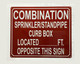 COMBINATION SPRINKLER STANDPIPE CURB BOX LOCATED FEET OPPOSITE THIS SAFETY SIGN SAFETY SIGN