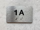 APT NUMBER 1A SAFETY SIGN-UNIT NUMBER SAFETY SIGN WITH RAISED LETTERS