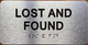 LOST AND FOUND COMPLIANCE SIGN WITH RAISED LETTERS