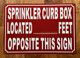 SPRINKLER CURB BOX LOCATED FEET OPPOSITE THIS SAFETY SIGN SAFETY SIGN
