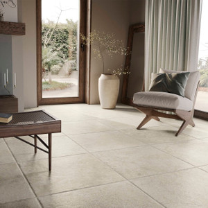 Showcasing the tile's elegant stone-effect finish in a cosy interior space with natural light and wooden accents. Showcasing the tile's elegant stone-effect finish in a cosy interior space with natural light and wooden accents.