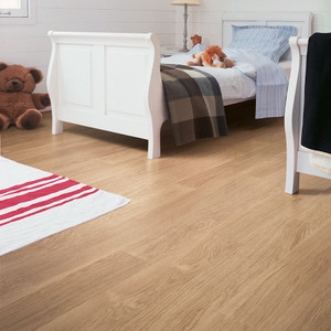 Quick-Step Eligna White Varnished Oak in a bedroom setting Quick-Step Eligna White Varnished Oak in a bedroom setting