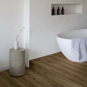 Quick-Step Classic Warm Brown Oak CLM5789 8mm Laminate Flooring (CLM5789) - Premium Quick-Step collection featuring brown luxury vinyl tile flooring with waterproof technology and easy click-fit installation