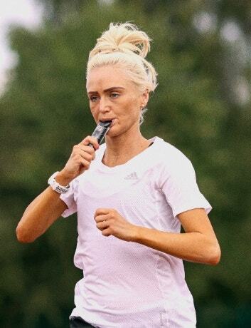Athlete drinking from SiS bottle