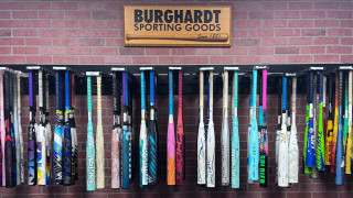Youth player choosing a correctly sized baseball bat at Burghardt Sporting Goods