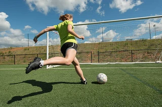 A youth soccer player working the ball