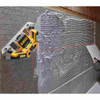 DeWalt DW0802 33 foot Laser Square showing in use levelling and squaring tiles during wall installation