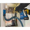 Bosch GBH18V-24CN 18V Cordless Brushless Bulldog SDS-Plus 1 inch Rotary Hammer (Tool Only) showing in use drilling into a concrete wall with dust extraction (Extractor sold separately)