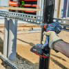 Bosch GDX18V-1860CB25 18V 1/4 inch & 1/2 inch Cordless Brushless Two-In-One Bit/Socket Impact Driver/Wrench Kit showing in use fastening Unistrut bracket to steel post