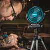 Makita DCF102Z 18V LXT Cordless 7-1/8 inch Jobsite Swing Fan (Tool Only) showing in use being pointed at a worker mounted to compatible tripod Makita DCF102Z 18V LXT Cordless 7-1/8 inch Jobsite Swing Fan (Tool Only) showing in use being pointed at a worker mounted to compatible tripod