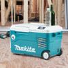 Makita DCW180Z 18V LXT  and 120V AC 20L Cooler / Warmer Box (Tool Only) showing cooler on a job site Makita DCW180Z 18V LXT  and 120V AC 20L Cooler / Warmer Box (Tool Only) showing cooler on a job site