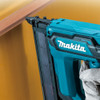 Makita DFN350Z 18V LXT Cordless 18 Gauge Finish Nailer (Tool Only) showing in use taking up a door jamb Makita DFN350Z 18V LXT Cordless 18 Gauge Finish Nailer (Tool Only) showing in use taking up a door jamb