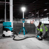 Makita DML814 18V LXT 3-Way LED Tower Light (Tool Only) showing in use lightening up a work area allowing someone to grind a concrete slab Makita DML814 18V LXT 3-Way LED Tower Light (Tool Only) showing in use lightening up a work area allowing someone to grind a concrete slab
