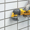 DeWalt DWA4220 3-5/8 inch Carbide Oscillating Fast Grout Removal Blade showing in use removing grout from between wall tiles DeWalt DWA4220 3-5/8 inch Carbide Oscillating Fast Grout Removal Blade showing in use removing grout from between wall tiles
