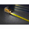 DeWalt DWHT35625S TOUGHSERIES 25 feet Lighted Tape Measure showing on job site with tape extended and LED light on
