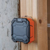 Klein Tools AEPJS3 Rechargeable Mid-Size Bluetooth Jobsite Speaker with Magnet & Hook showing mounted to a wooden stud Klein Tools AEPJS3 Rechargeable Mid-Size Bluetooth Jobsite Speaker with Magnet & Hook showing mounted to a wooden stud