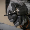Klein Tools KTSB14 #14 12-Step 3/16-inch to 7/8-inch Double-Fluted High-Speed Step Drill Bit showing in use being installed into a drill chuck Klein Tools KTSB14 #14 12-Step 3/16-inch to 7/8-inch Double-Fluted High-Speed Step Drill Bit showing in use being installed into a drill chuck