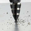 Klein Tools KTSB15 #15 3-Step 7/8 inch to 3/8 inch Double-Fluted High-Speed Step Drill Bit showing in use drilling into sheet metal Klein Tools KTSB15 #15 3-Step 7/8 inch to 3/8 inch Double-Fluted High-Speed Step Drill Bit showing in use drilling into sheet metal