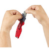 Milwaukee 48-22-1500 FASTBACK Compact Folding Utility Knife showing blade change on the fly Milwaukee 48-22-1500 FASTBACK Compact Folding Utility Knife showing blade change on the fly