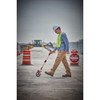 Milwaukee 48-22-5006 6 inch Measuring Wheel showing in use measuring out on concrete pad