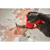 Milwaukee 49-25-1503 OPEN-LOK 1-3/8-inch Universal Fit Titanium Enhanced Carbide Teeth Metal Cutting Multi-Tool Oscillating Blades - 3pk showing in use cutting nail sticking out of a sub floor Milwaukee 49-25-1503 OPEN-LOK 1-3/8-inch Universal Fit Titanium Enhanced Carbide Teeth Metal Cutting Multi-Tool Oscillating Blades - 3pk showing in use cutting nail sticking out of a sub floor
