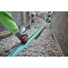 Milwaukee 48-22-1426 26ft/8m Stud Tape Measure showing in use measuring a pipe partial buried in gravel