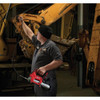 Milwaukee 2646-22CT M18 Cordless 2-Speed Grease Gun Kit showing in use lubricating heavy equipment joints