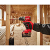 Milwaukee 3693-22CX M18 2-Tool Cordless Brushless Compact 1/2 inch Hammer Drill/Driver & 1/4 inch Hex 3-Speed Impact Driver Combo Kit showing in use drilling into a wood stud