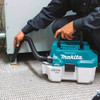 Makita DVC750LZ 18V 7.5L Portable Wet/Dry Vacuum Cleaner vacuuming (battery sold separately)