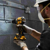 DeWalt DCD805B 20V MAX XR Brushless Cordless 1/2 Inch Hammer Drill/Driver (Tool Only) showing in use fastening a screw to a concrete wall holding metal pipe to the wall (battery sold separately) DeWalt DCD805B 20V MAX XR Brushless Cordless 1/2 Inch Hammer Drill/Driver (Tool Only) showing in use fastening a screw to a concrete wall holding metal pipe to the wall (battery sold separately)