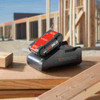 Bosch GXS18V-15N15 18V Rapid Charger with CORE18V 4.0 Ah Compact Battery showing battery and charger on jobsite
