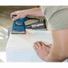 Bosch GSS20-40 2 Amp 1/4-Sheet Orbital Finishing Sander showing sanding with included dust bag showing
