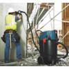 Bosch VAC140AH 9.5 Amp 14-Gallon Wet/Dry Dust Extractor showing vacuum attached to grinder dust extractor