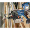 Bosch GBH18V-28DCN PROFACTOR 18V Cordless Brushless SDS-Plus 1-1/8 inch Rotary Hammer (Tool Only) showing in use drilling into concrete wall to mount metal conduit