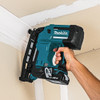 Makita DBN600Z 18V LXT Cordless 16-Gauge 2-1/2 inch Finish Nailer (Tool Only) showing in use nailing crown molding to the ceiling Makita DBN600Z 18V LXT Cordless 16-Gauge 2-1/2 inch Finish Nailer (Tool Only) showing in use nailing crown molding to the ceiling