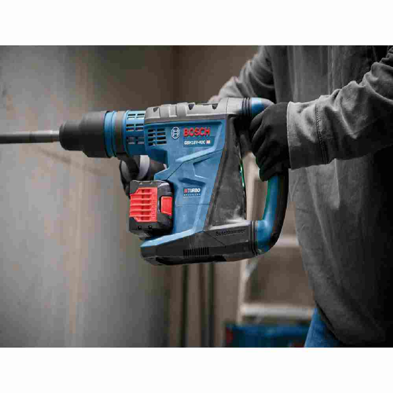 Bosch GBH18V-40CK27 PROFACTOR 18V Cordless Brushless SDS-Max 1-5/8 inch Rotary Hammer Kit showing in use drilling into a concrete wall