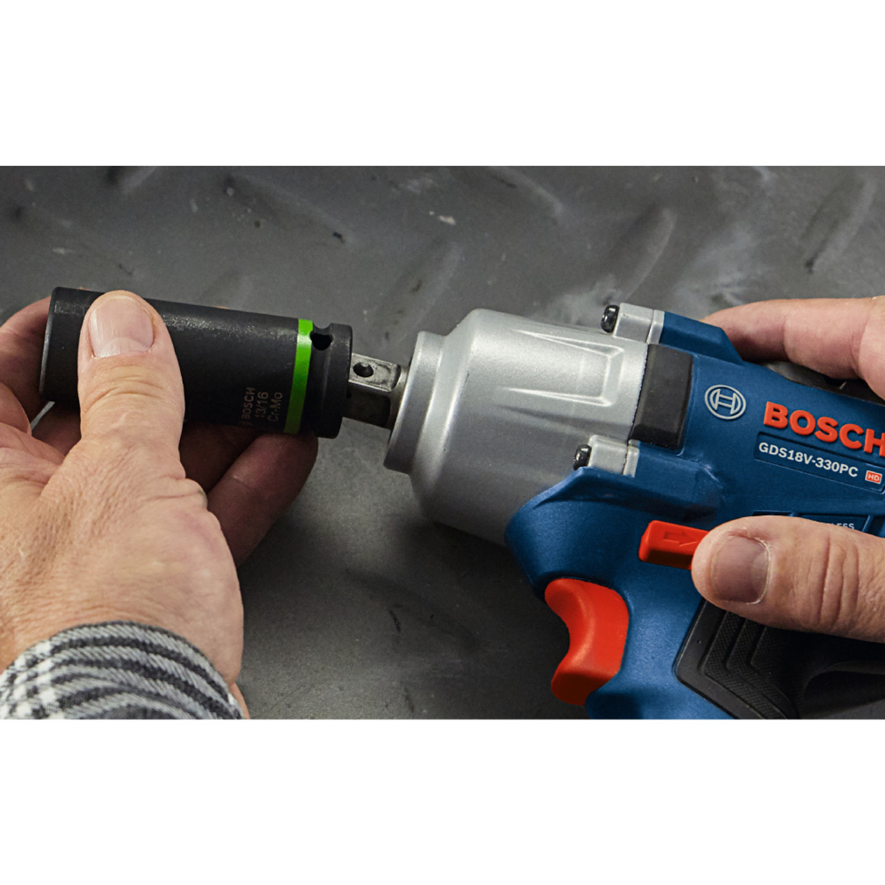 Bosch GDS18V-330PCN Cordless Brushless 1/2 inch Mid-Torque Impact Wrench with Pin Detent (Tool Only) showing the attaching of a socket onto the anvil Bosch GDS18V-330PCN Cordless Brushless 1/2 inch Mid-Torque Impact Wrench with Pin Detent (Tool Only) showing the attaching of a socket onto the anvil