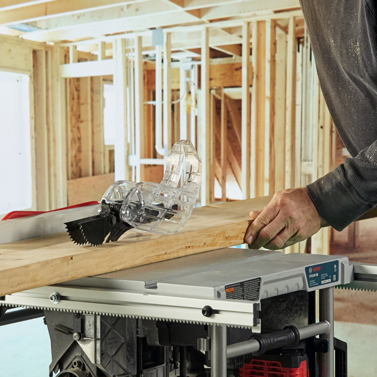 Bosch GTS18V-08N PROFACTOR 18V 8-1/4 inch Portable Table Saw (Tool Only) showing in use cutting down a two by dimensional lumber