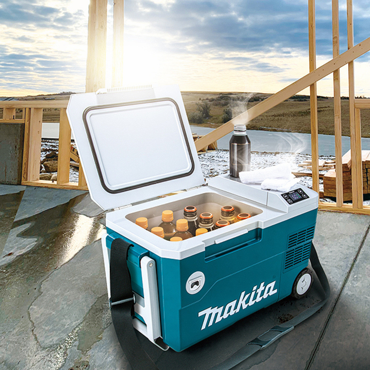 Makita DCW180Z 18V LXT & 120V AC 20L Cooler / Warmer Box (Tool Only) showing cooler on a job site full of drinks Makita DCW180Z 18V LXT & 120V AC 20L Cooler / Warmer Box (Tool Only) showing cooler on a job site full of drinks