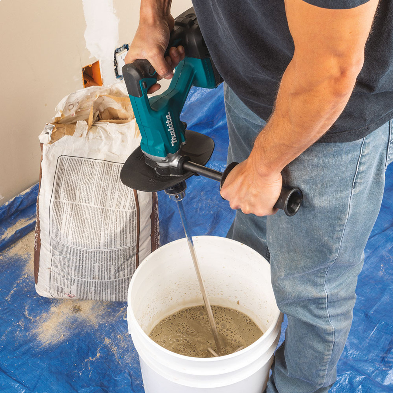 Makita DUT131Z 18V LXT Cordless Brushless 1/2 inch Mud Mixer Drill (Tool Only) showing in use mixing drywall mud