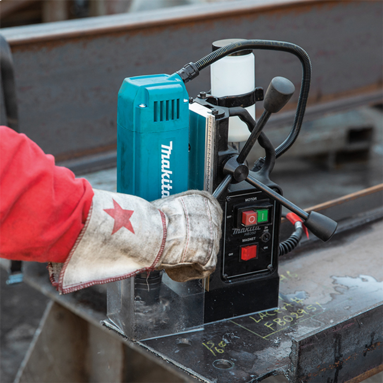 Makita HB350 10 Amp 1-3/8 inch Magnetic Drill showing in use drilling through an I-beam Makita HB350 10 Amp 1-3/8 inch Magnetic Drill showing in use drilling through an I-beam